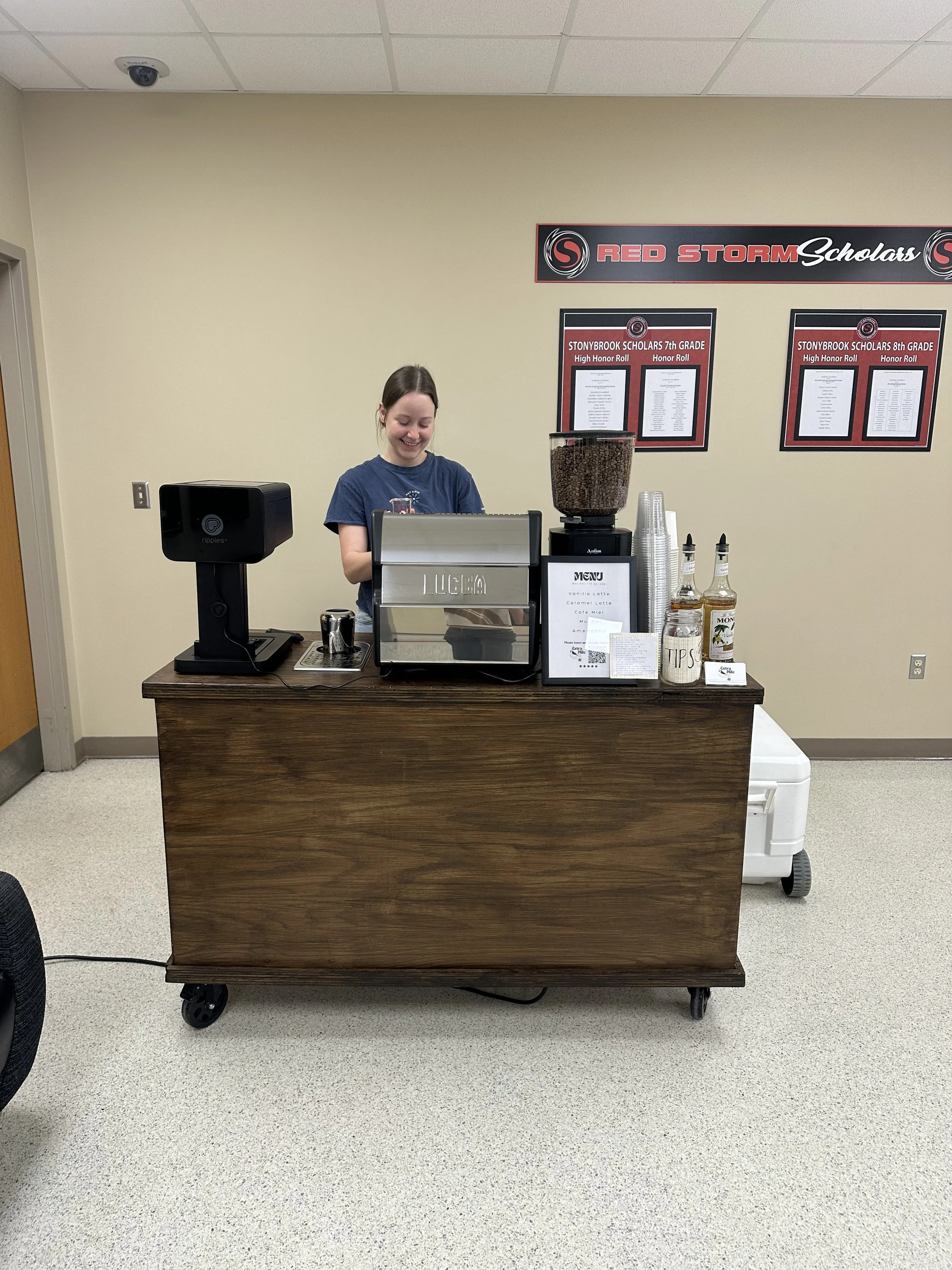 Barista pouring latte art at Indianapolis coffee catering event