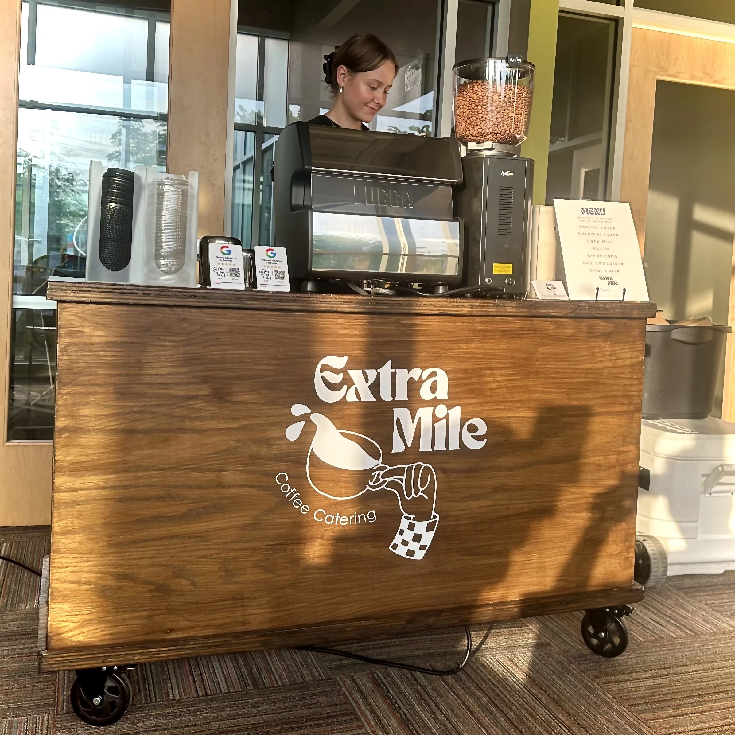 Latte art poured at an Indianapolis coffee cart catering event