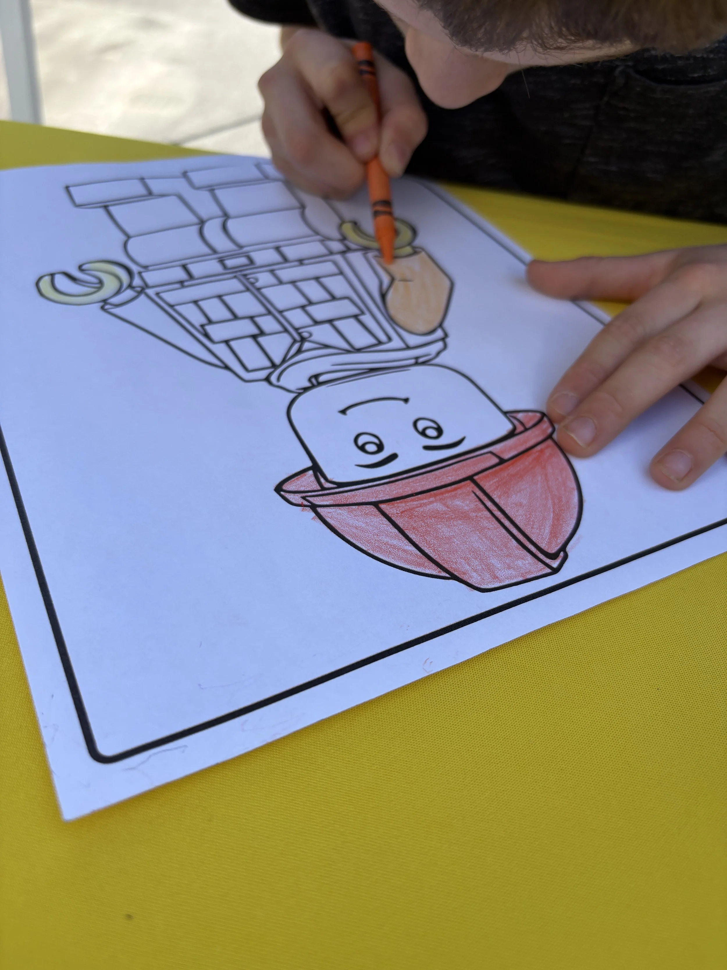 Kid coloring at party