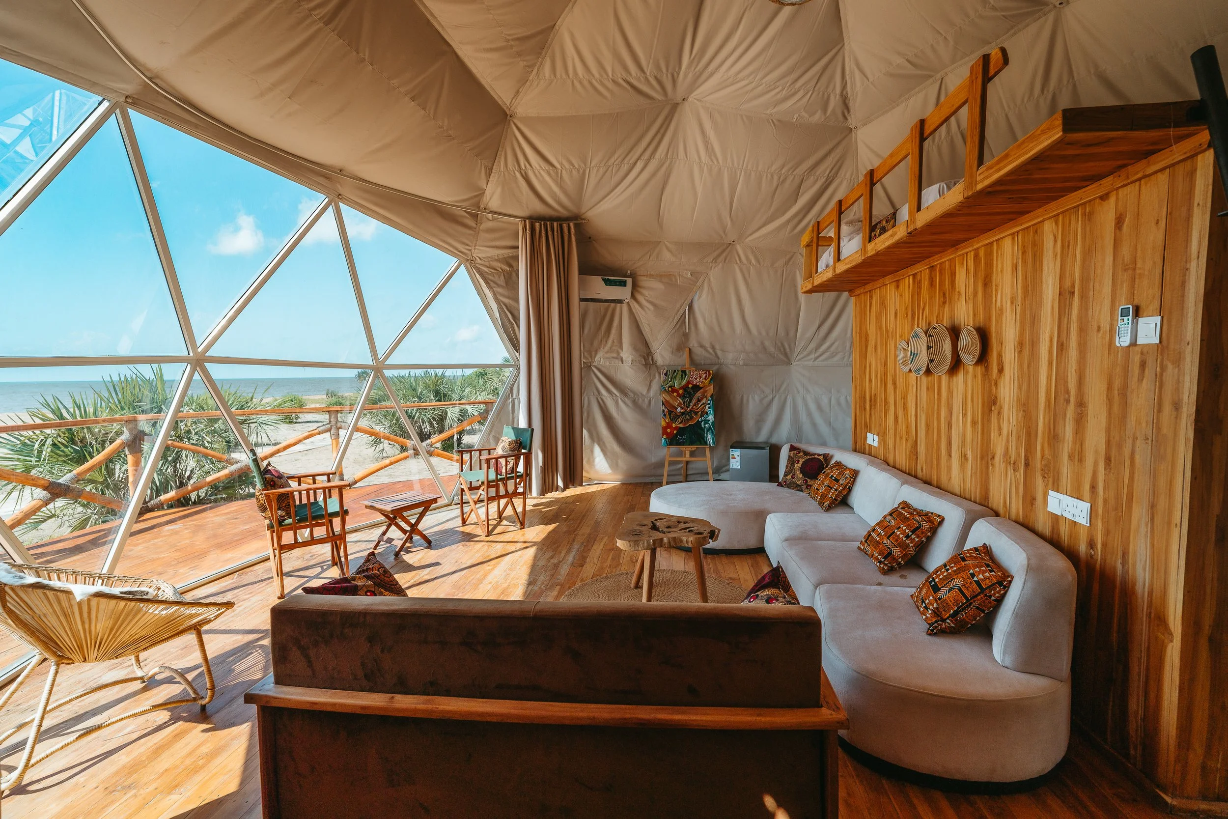 Interior of a geodesic dome tent looking out to the ocean