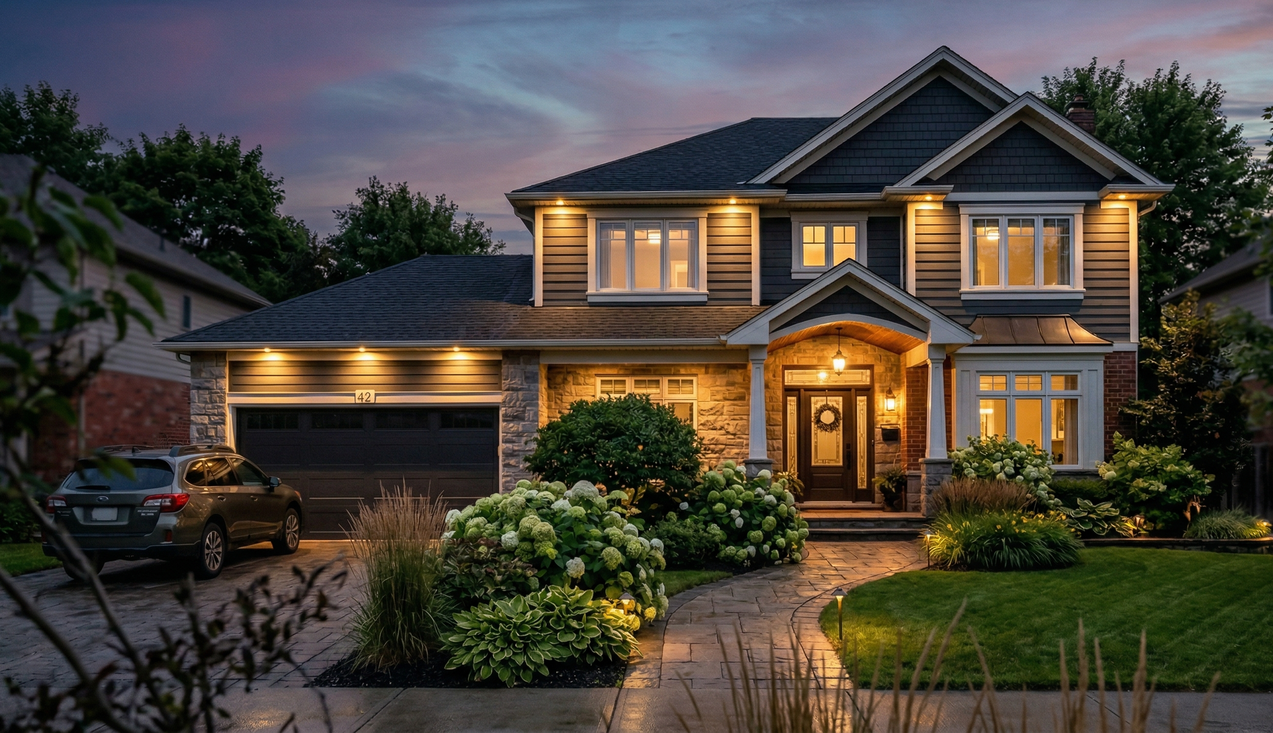 Exterior pot lights Edmonton home Raylum Lighting