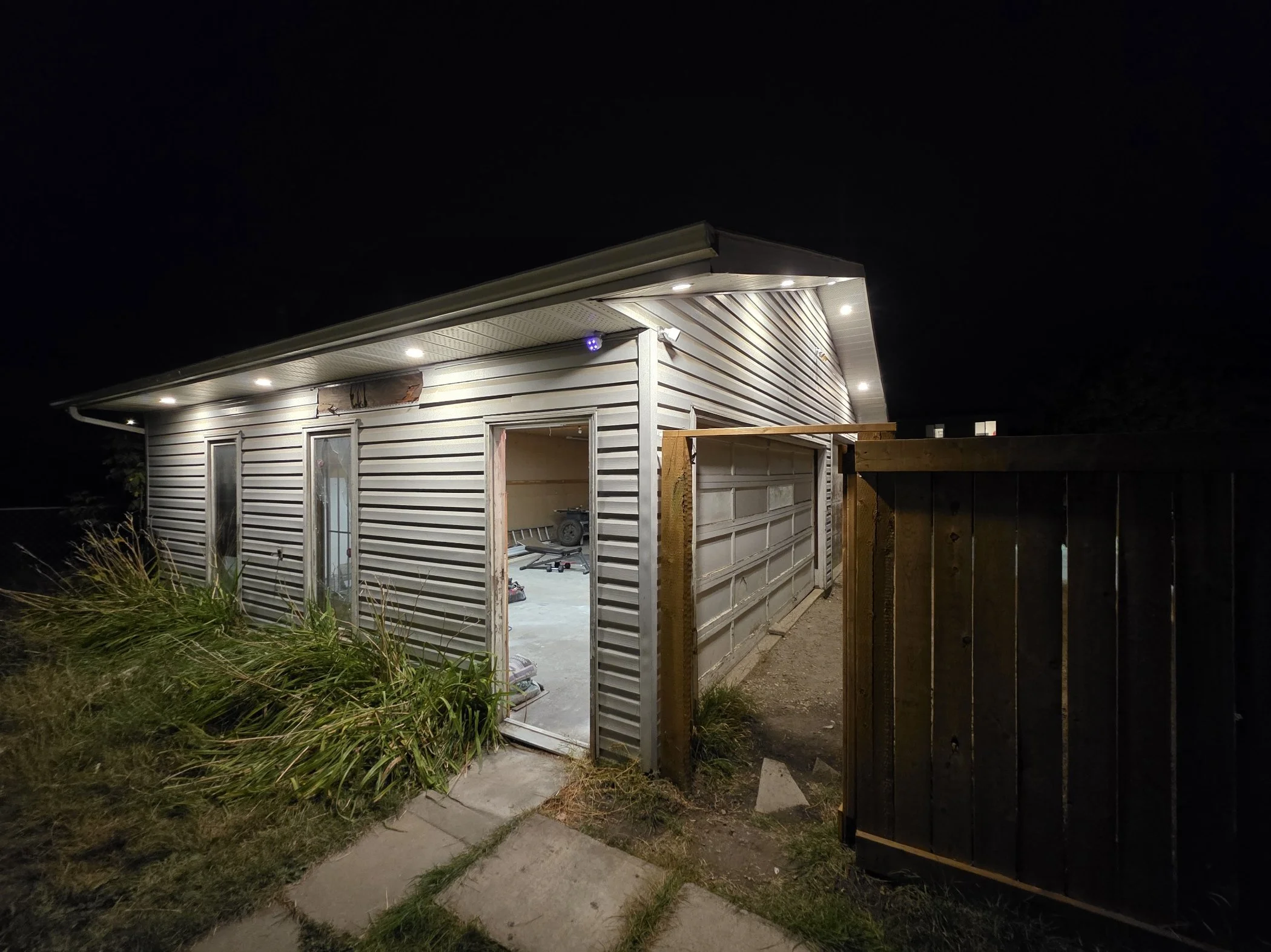 Exterior pot lights Edmonton home Raylum Lighting