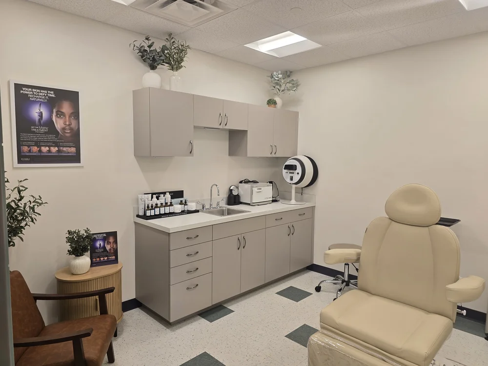 SkanWell treatment room with a reclining treatment chair and skincare equipment