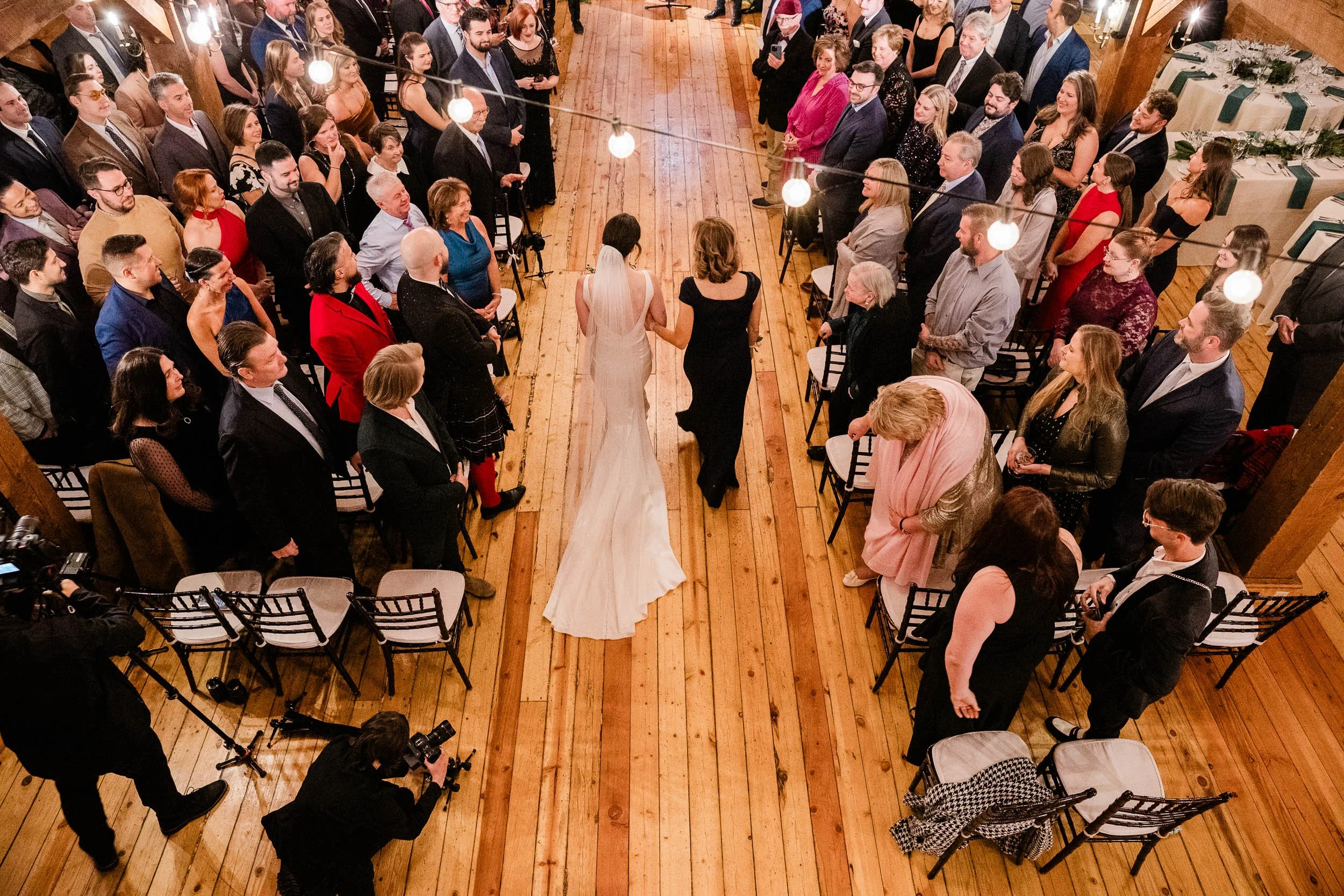 Kayleigh walking down the aisle toward Merrick