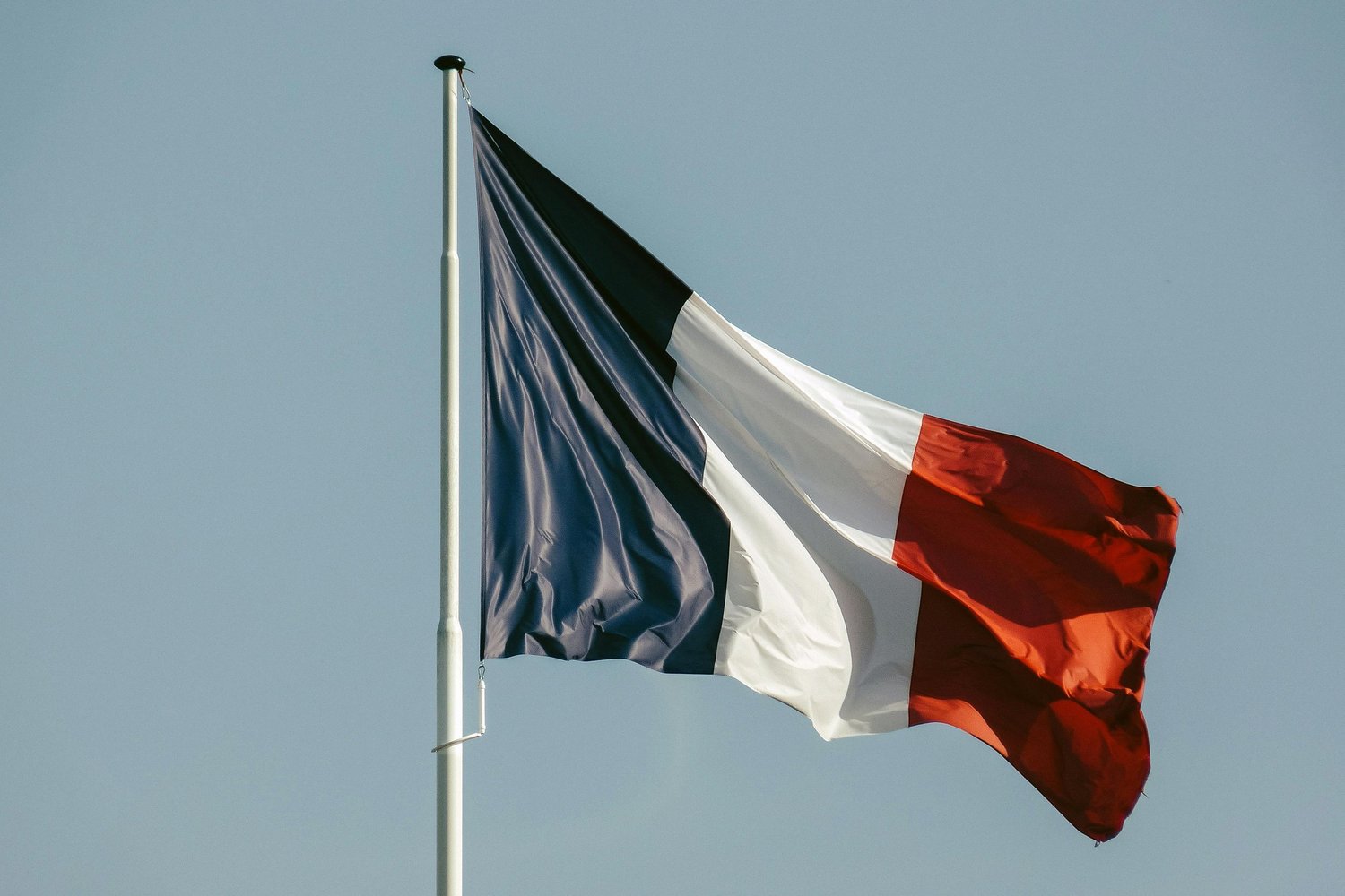 French tricolour flag — bleu-blanc-rouge, the chromatic and political source of La Diffrance poster by StudioKus