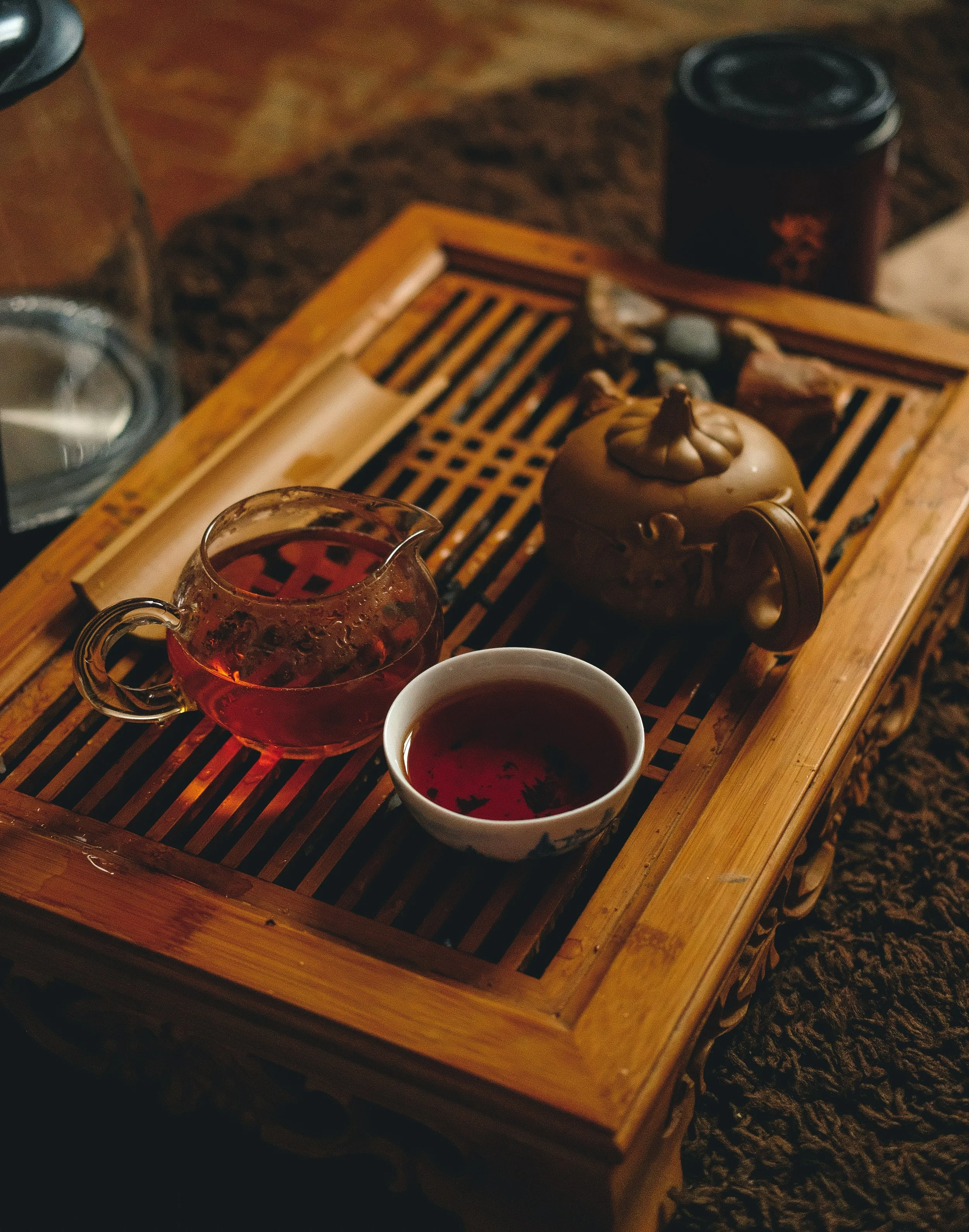 Traditional Japanese tea ceremony room in Kyoto, tatami
         matting, ceramic bowls of matcha, paper shoji screens,
         morning light