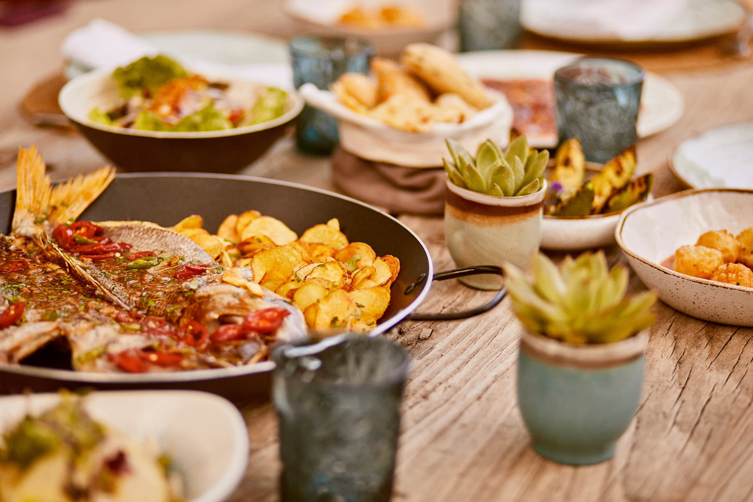 Table of fresh island produce, tomatoes and basil, at Teranka Garden restaurant, Formentera