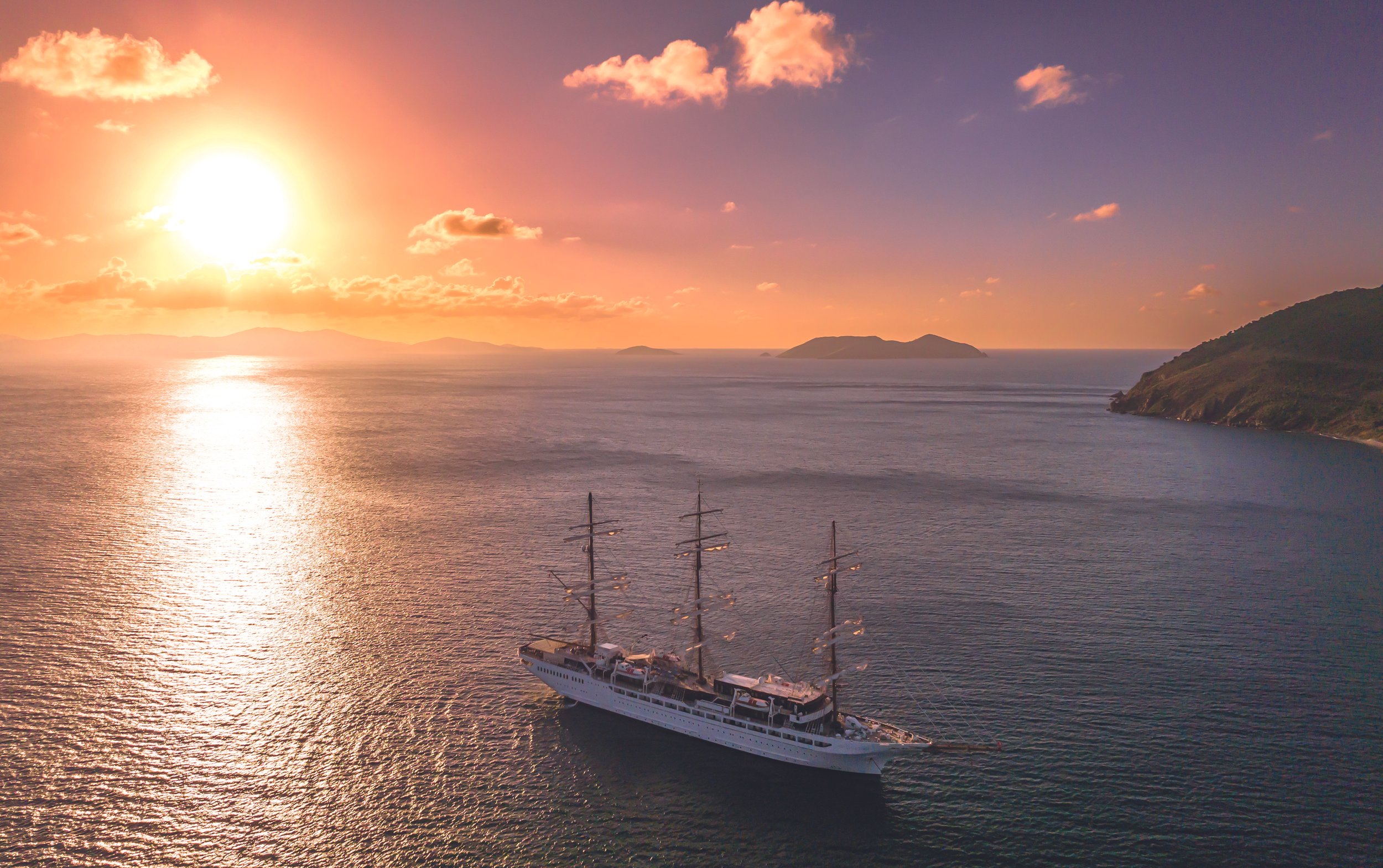 Sea Cloud Spirit windjammer under full sail at sunset in the Mediterranean