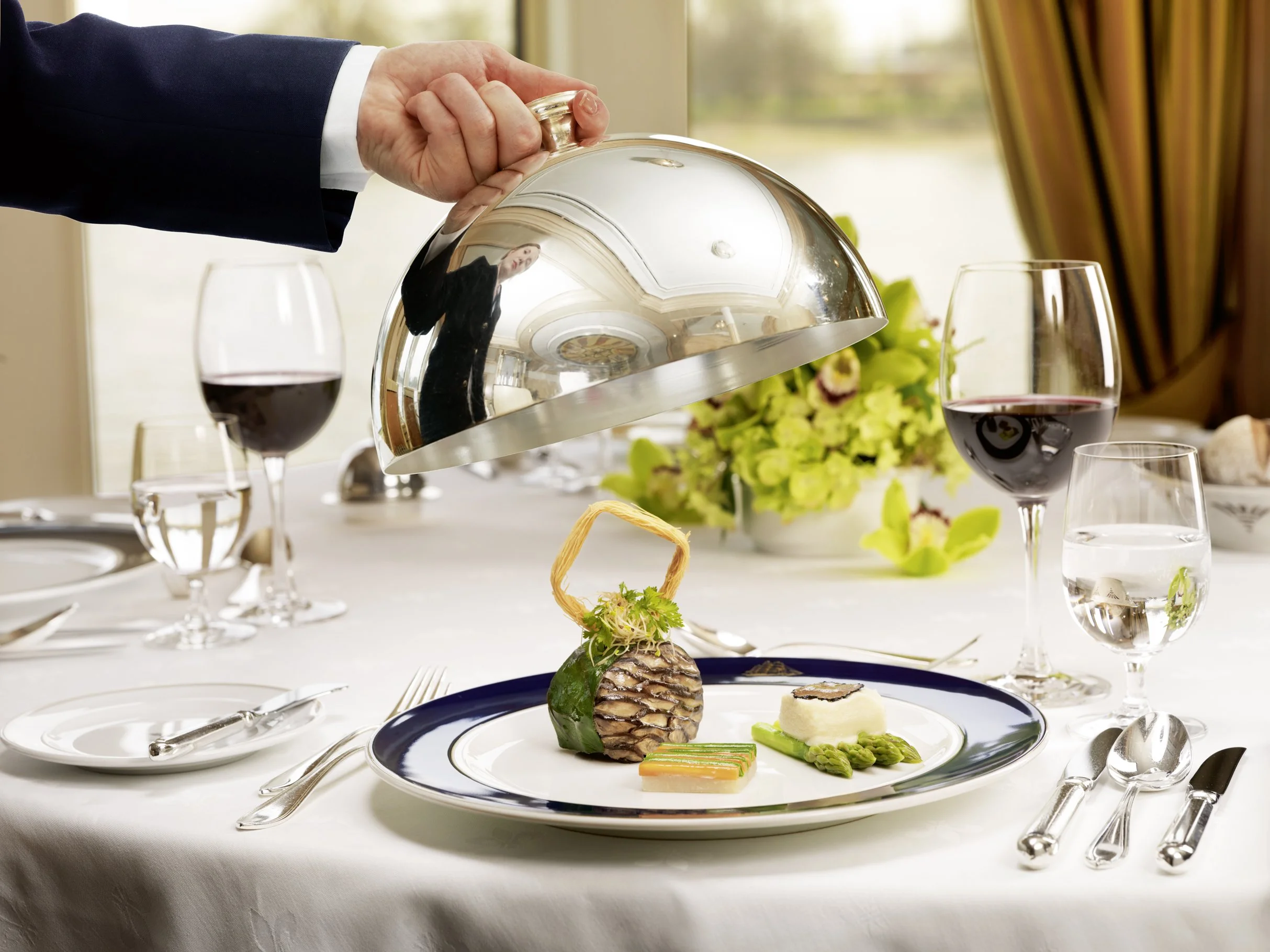 Sea Cloud II dining saloon set for dinner with period-style interiors