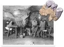 Early excavation underway inside Kents Cavern, with flint finds