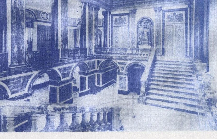 The grand staircase at Oldway Mansion, a branching marble stair rising between columns