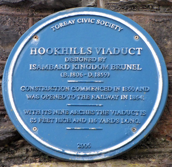 Blue plaque reading Torbay Civic Society, Hookhills Viaduct, designed by Isambard Kingdom Brunel, born 1806 died 1859, construction commenced in 1860 and was opened to the railway in 1864, with its nine arches the viaduct is 85 feet high and 116 yards long, 2006