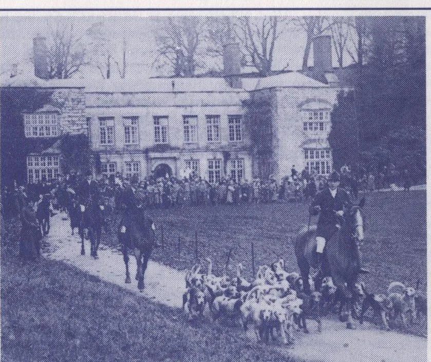 Photograph of the Haldon Harriers meeting on the lawn in front of Cockington Court about 1923, with riders, hounds and a large crowd of spectators