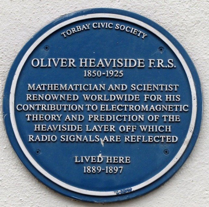 Blue plaque reading Torbay Civic Society, Oliver Heaviside F.R.S., 1850 to 1925, mathematician and scientist renowned worldwide for his contribution to electromagnetic theory and prediction of the Heaviside Layer off which radio signals are reflected, lived here 1889 to 1897