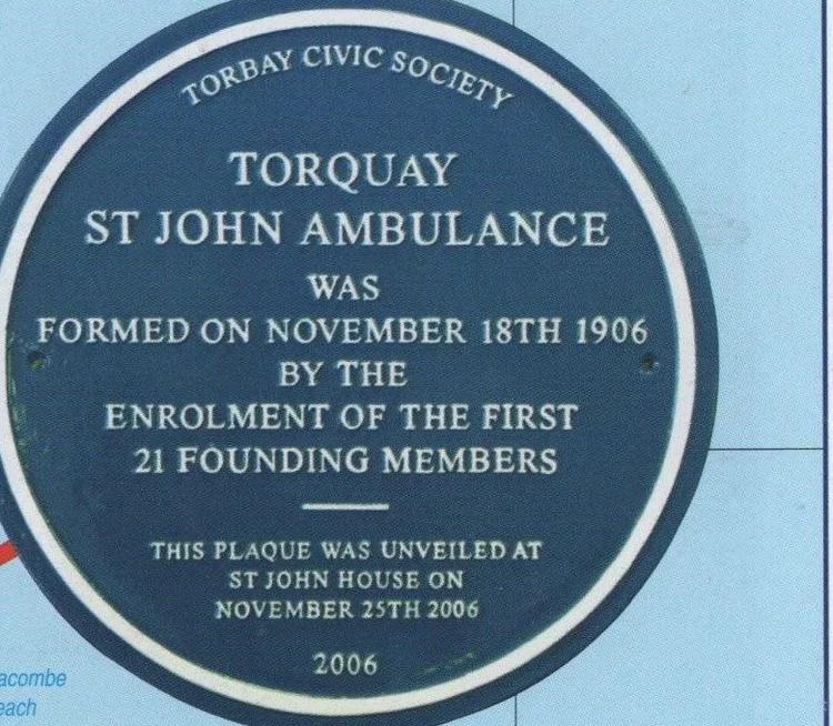 Blue plaque reading Torbay Civic Society, Torquay St John Ambulance was formed on November 18th 1906 by the enrolment of the first 21 founding members, this plaque was unveiled at St John House on November 25th 2006, 2006