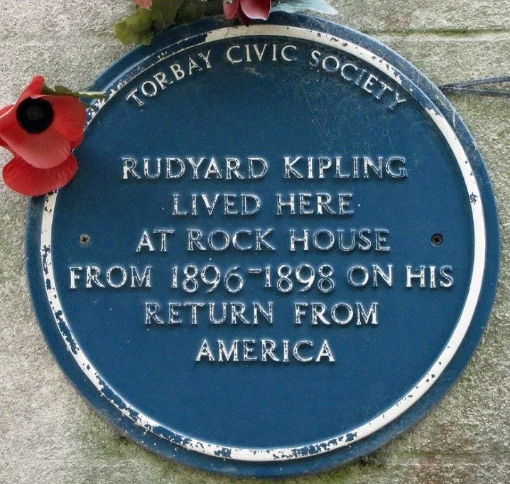 Blue plaque reading Torbay Civic Society, Rudyard Kipling lived here at Rock House from 1896 to 1898 on his return from America