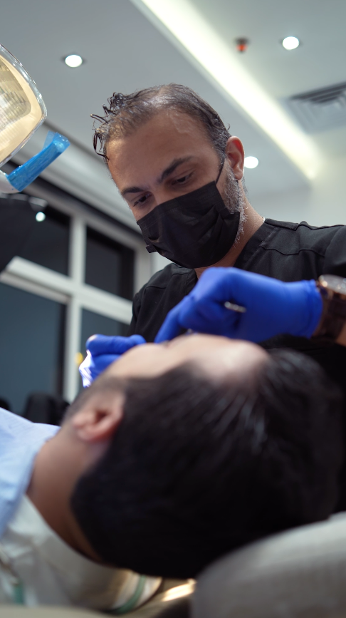 Dr. Amr Mostafa providing treatment