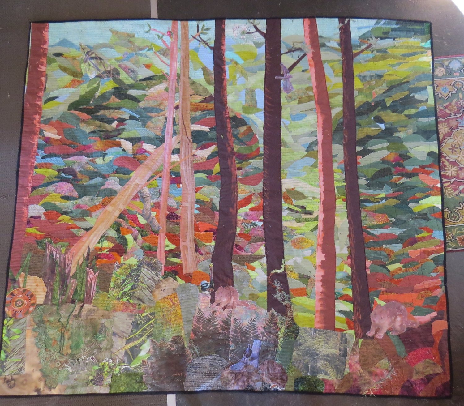 Community quilt depicting the trees and wildlife of Bulga Forest
