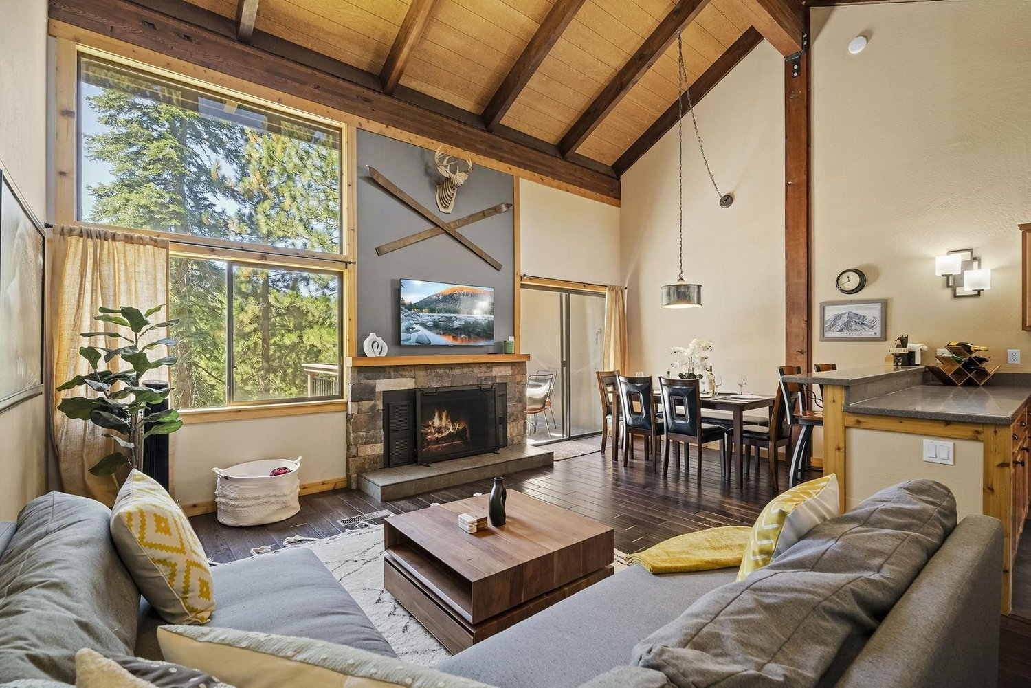 Vaulted great room with stone fireplace
