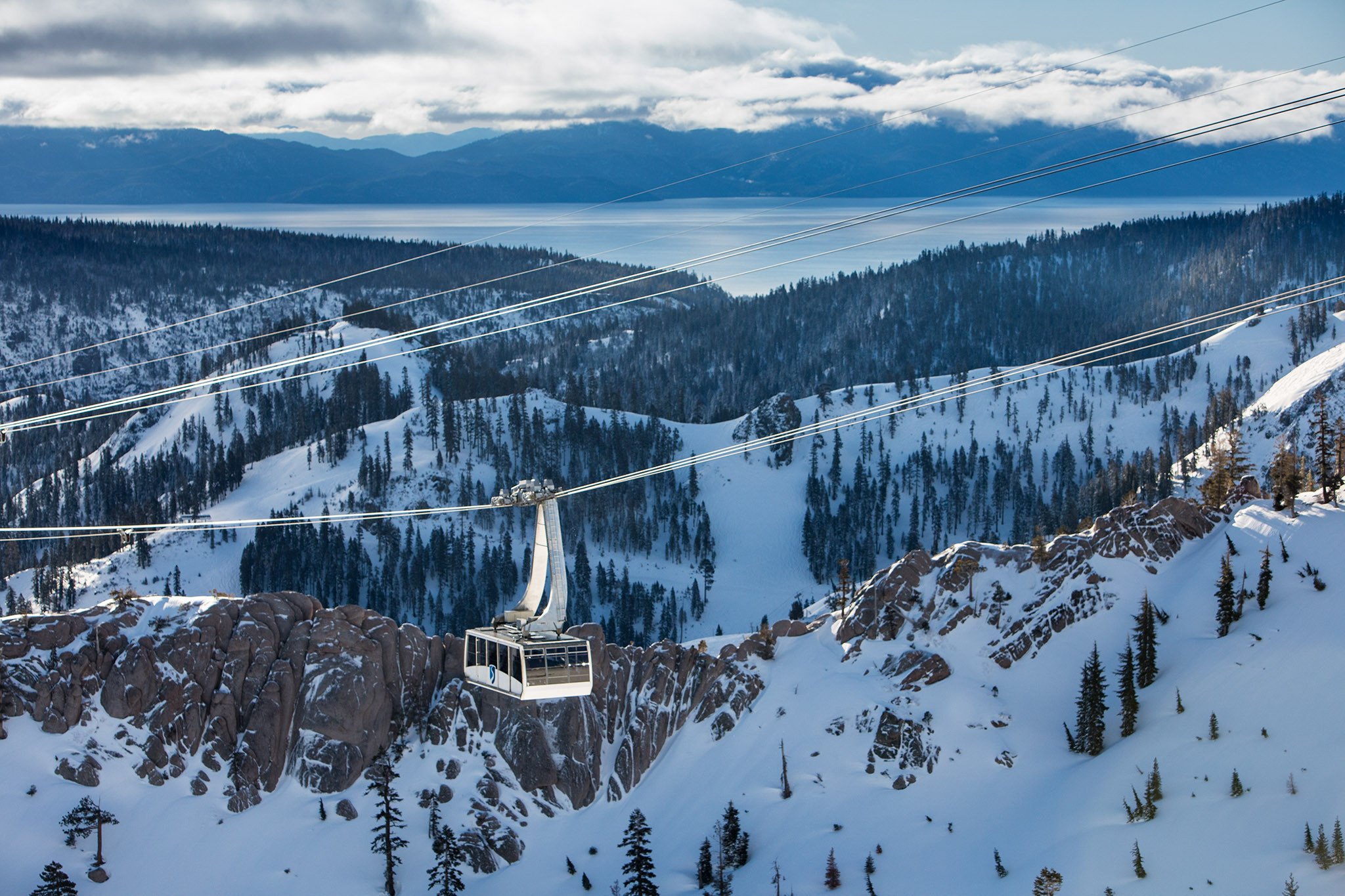 Aerial tram above Olympic Valley with Lake Tahoe beyond