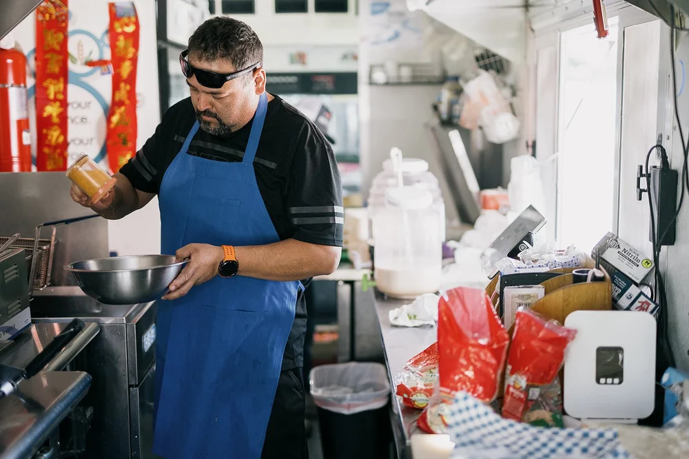 Cooking on the line inside the Morelos Tacos kitchen