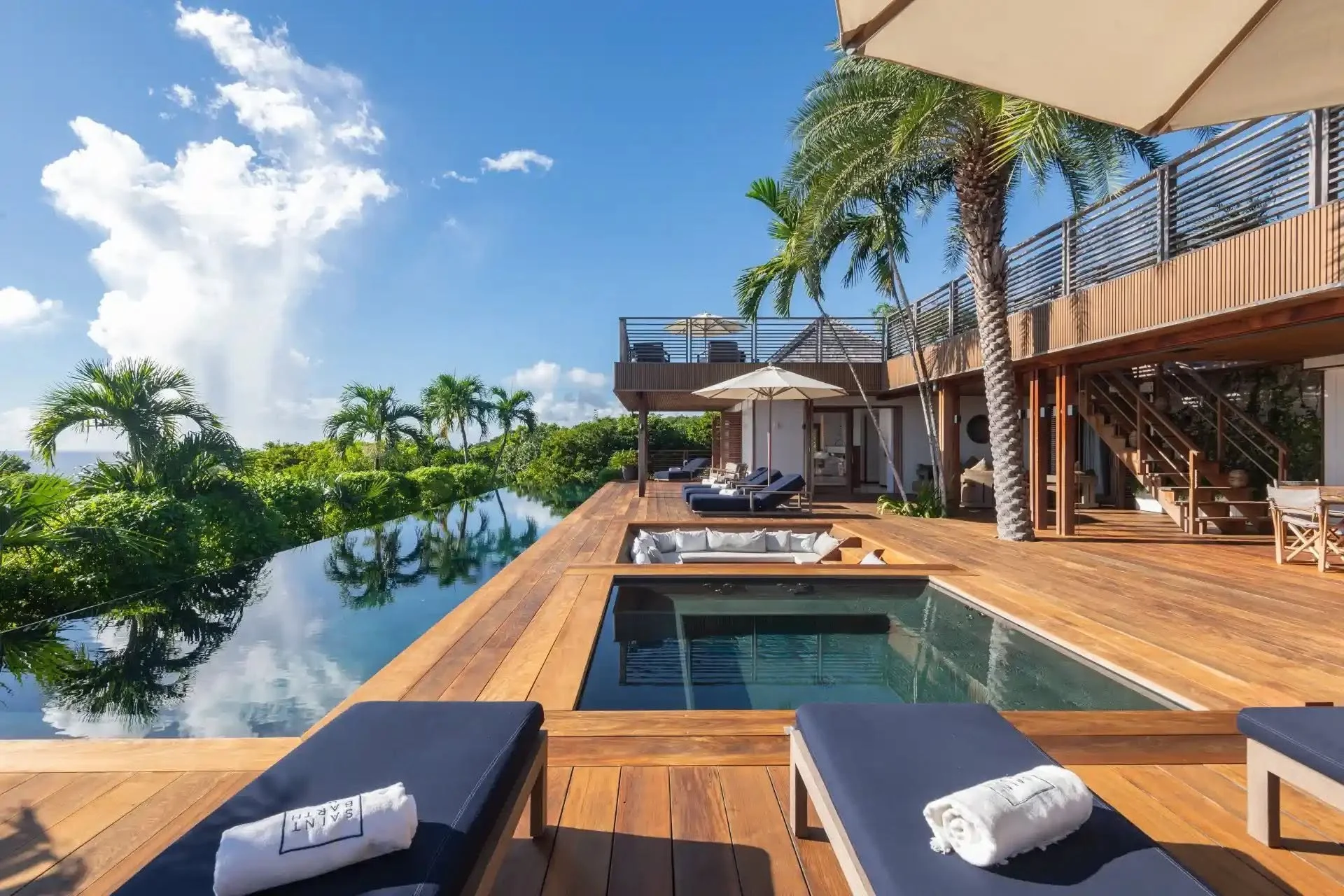 Infinity pool and palms at a WIMCO villa on St. Barths