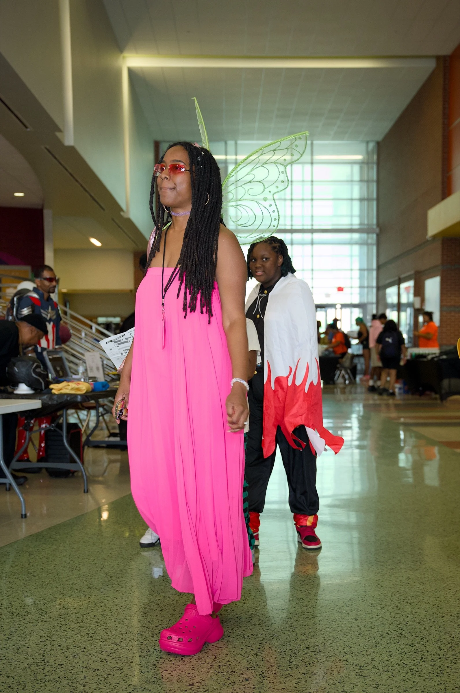 Cosplayer in a pink costume at Blerdfest