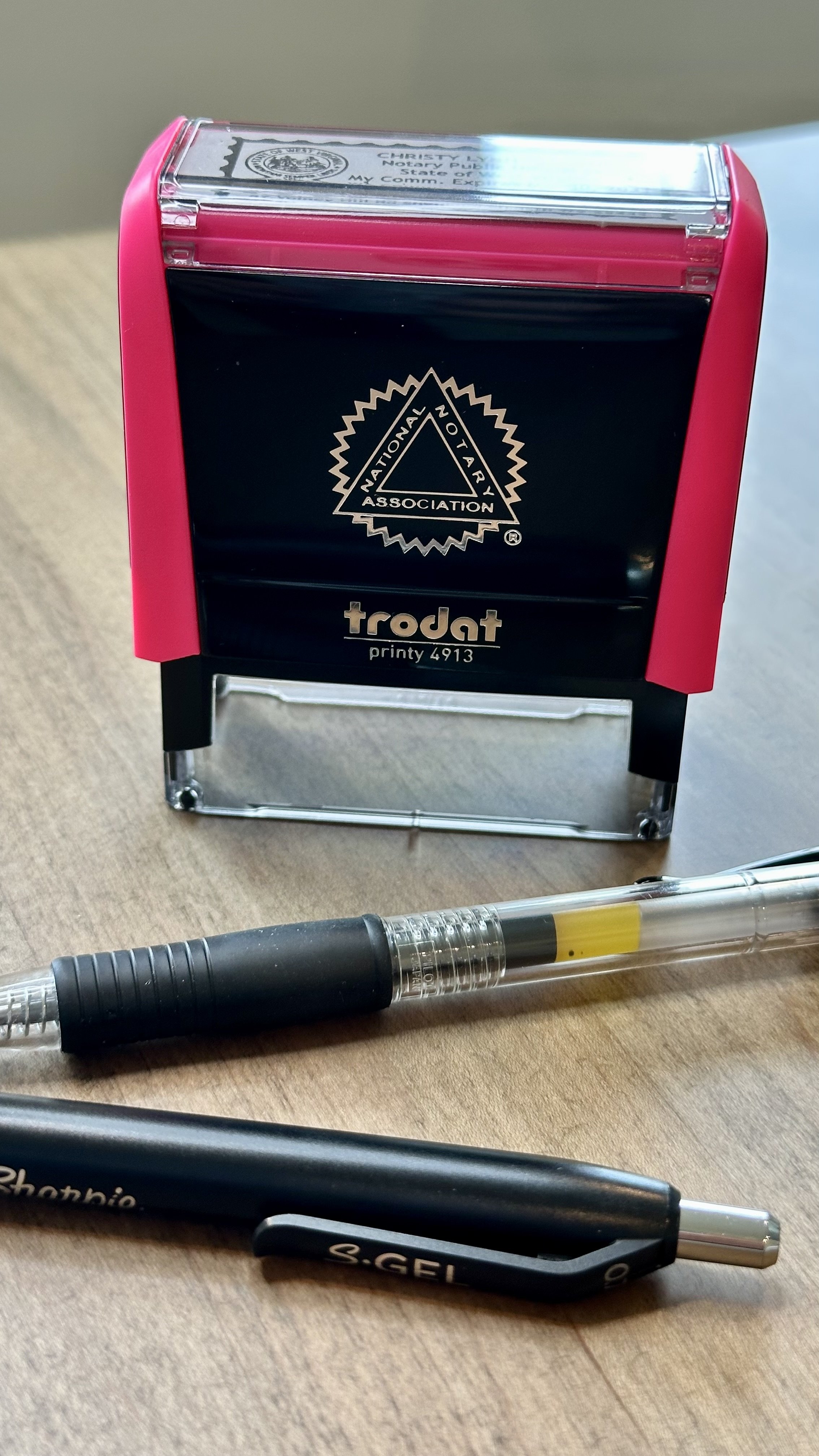 Notary stamp and pens ready for a signing