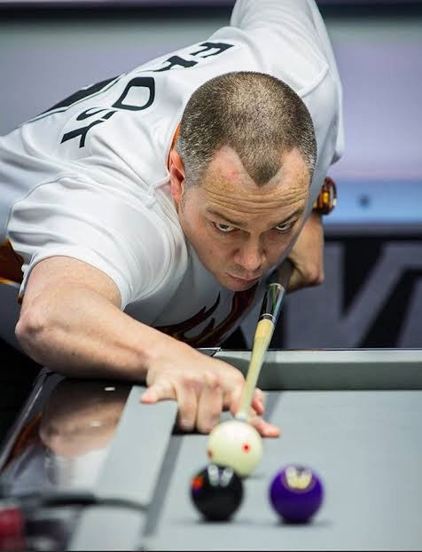 Scott Frost focused on the cue ball just before his stroke