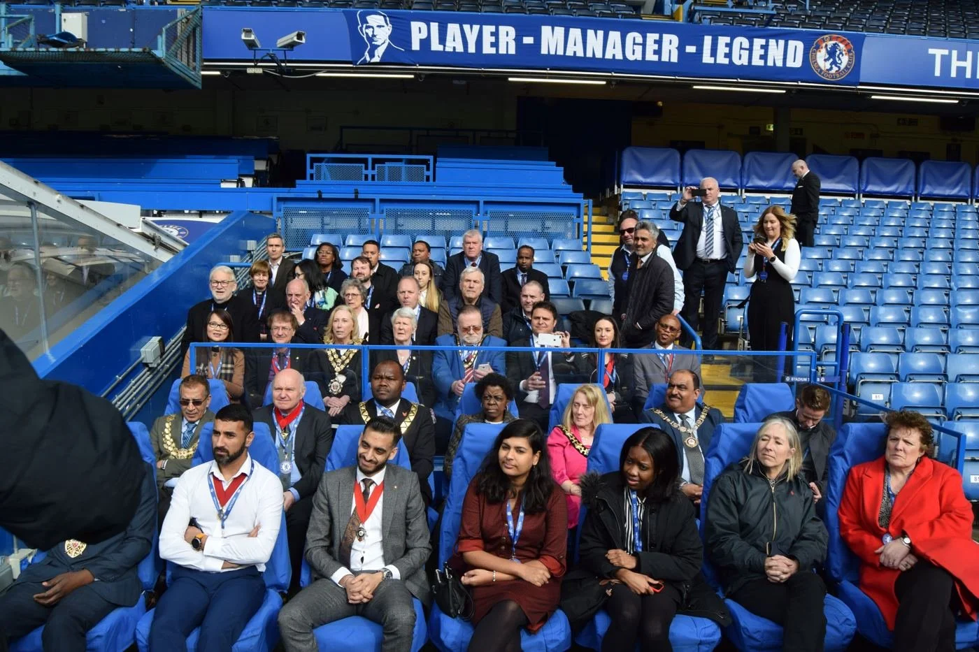 Mayors and civic guests seated pitchside at Stamford Bridge