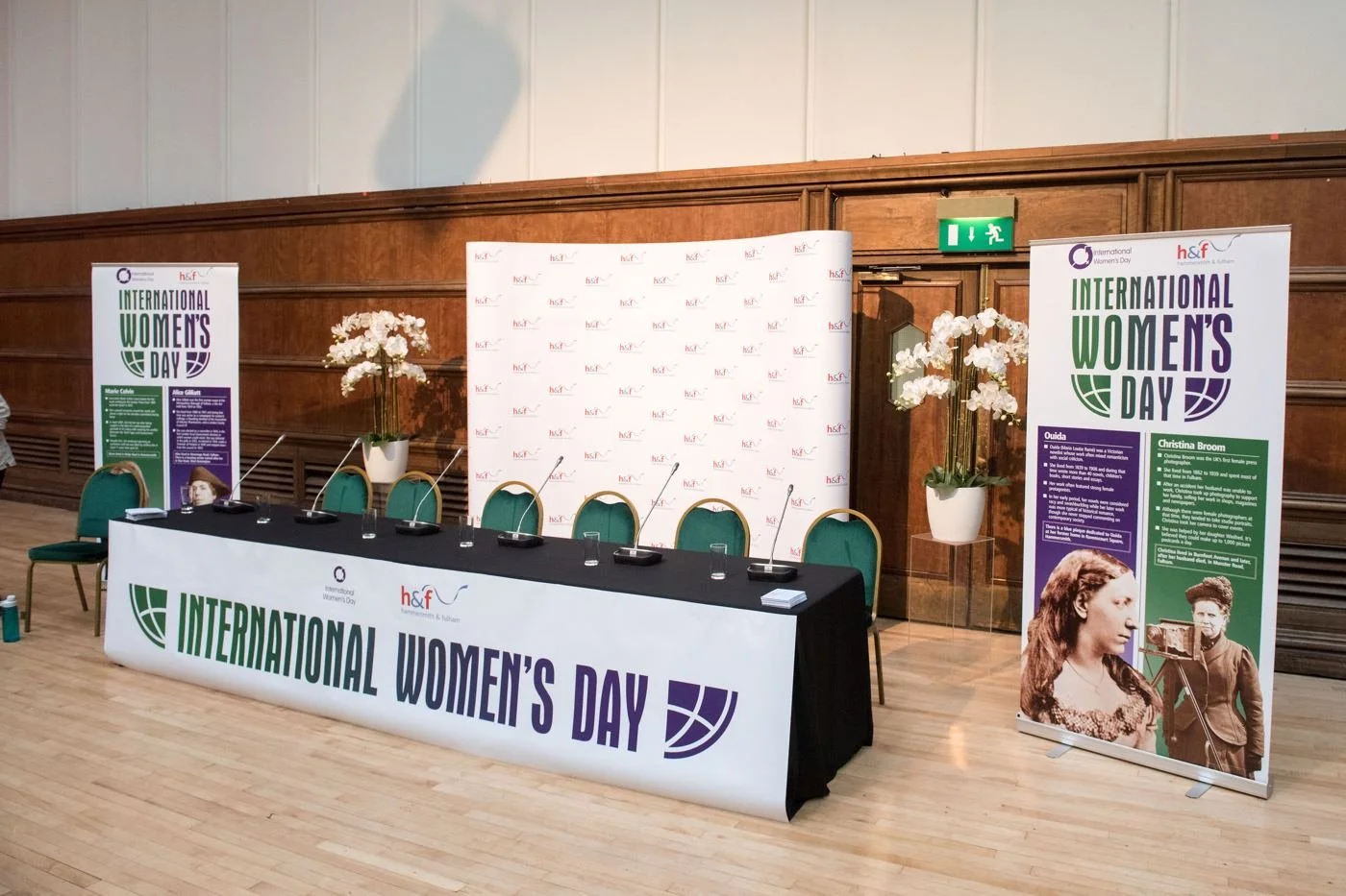 Panel table and banners set for International Women's Day
