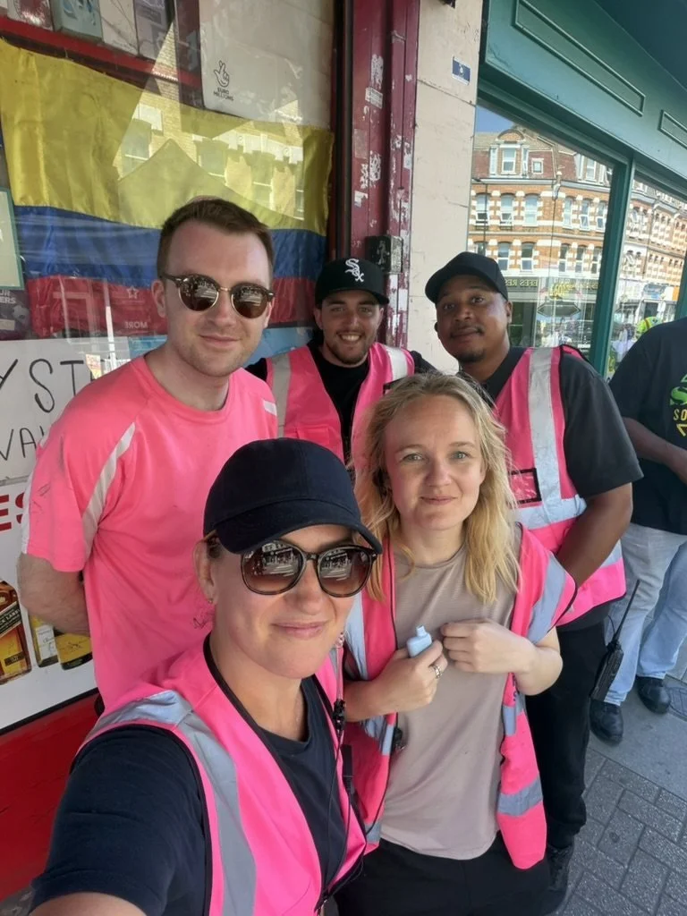 The event team in pink high vis vests on North End Road