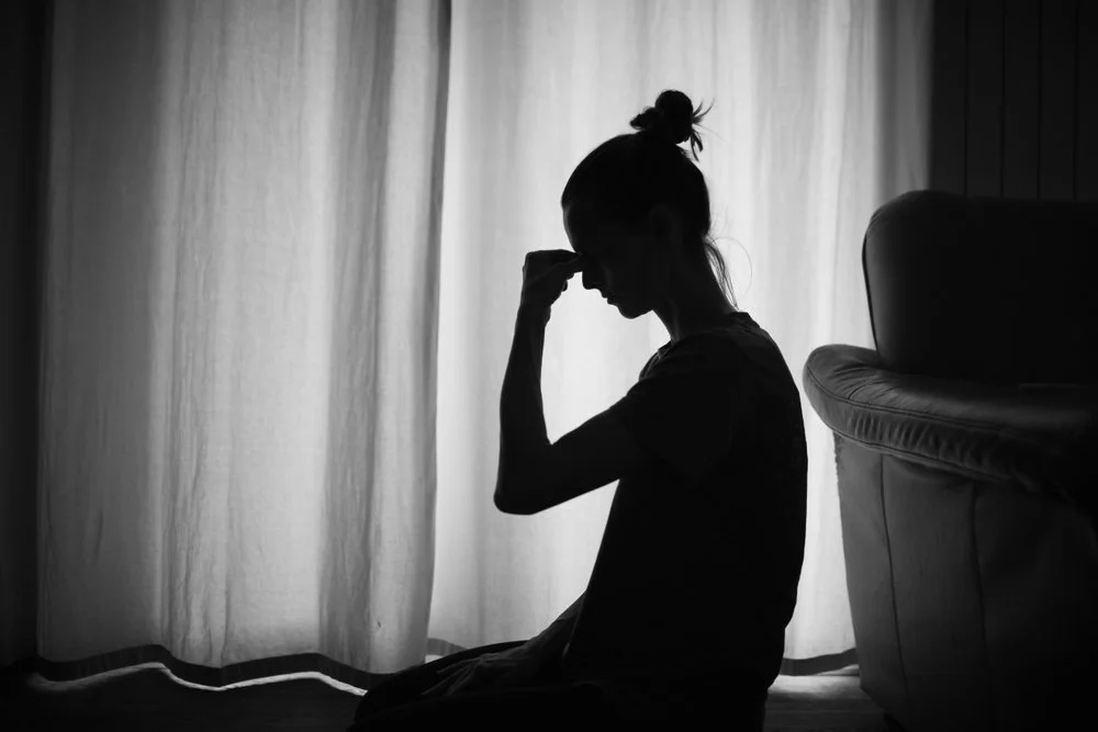 People climbing and supporting each other