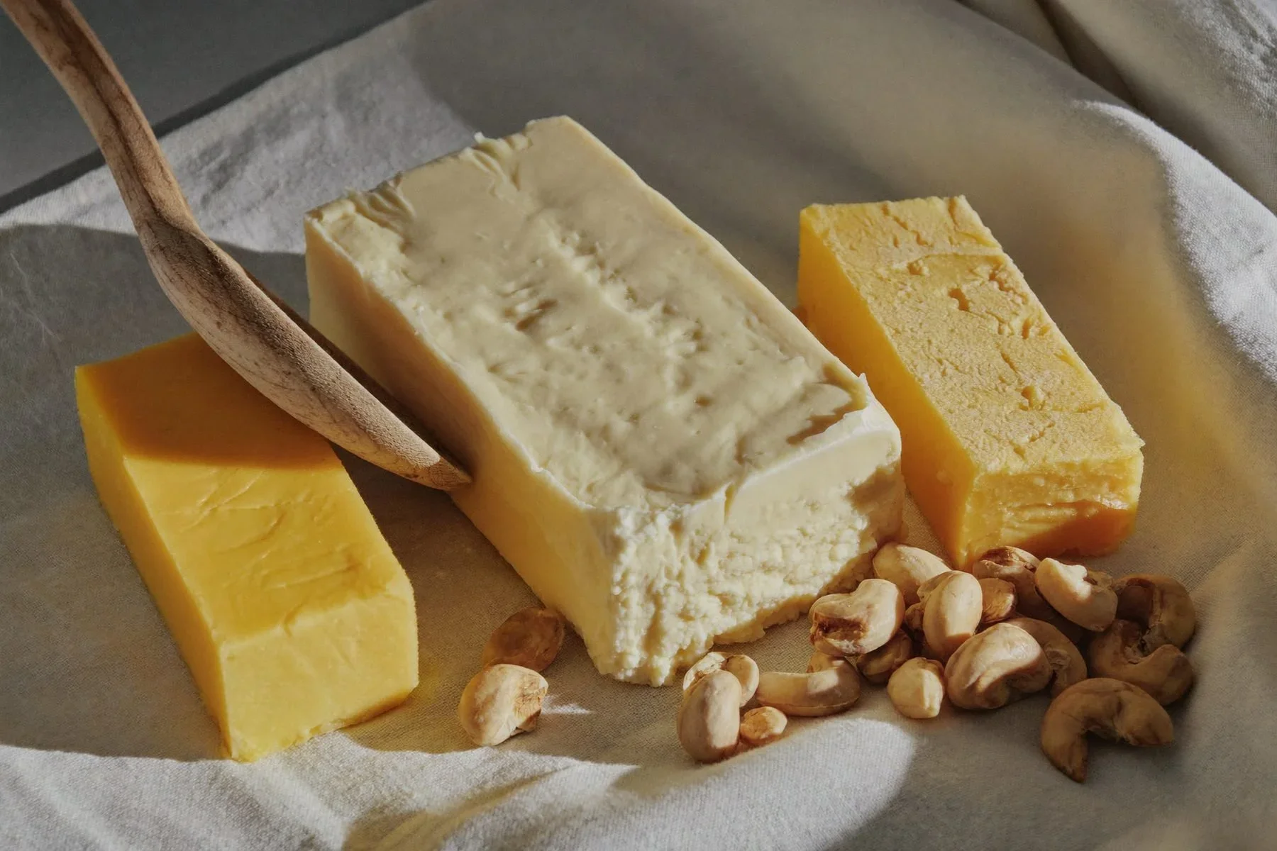 Raw shea butter and mango butter blocks with shea nuts