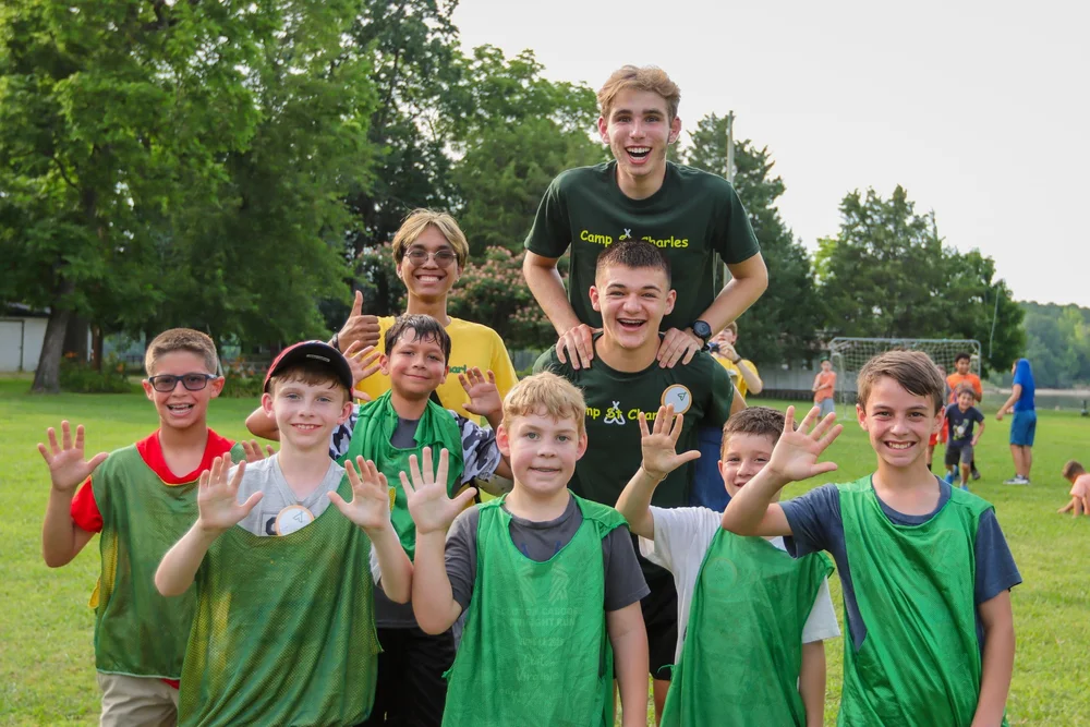 Boys soccer team smiling after a game