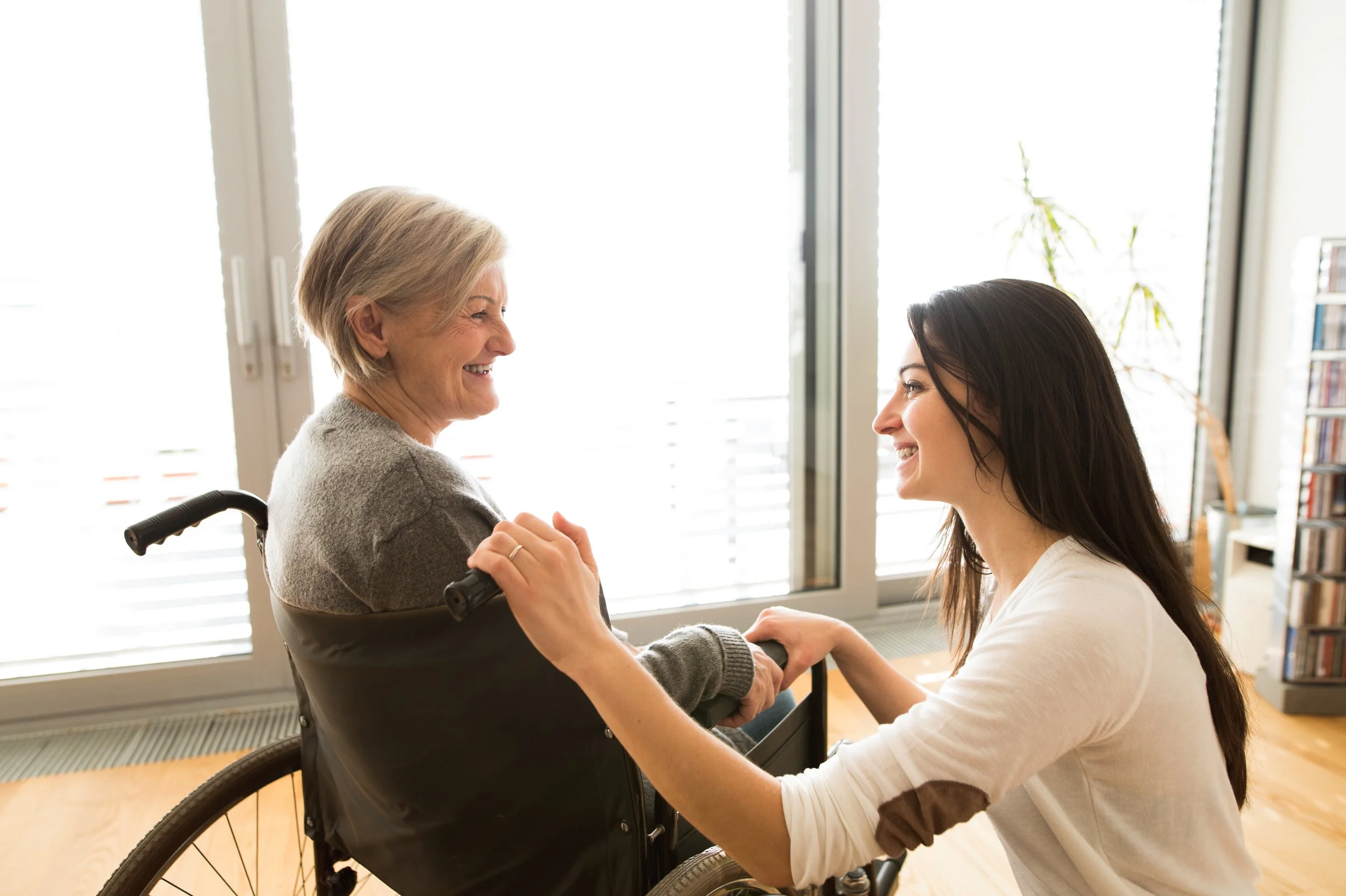 Adult child helping aging parent review care information at home