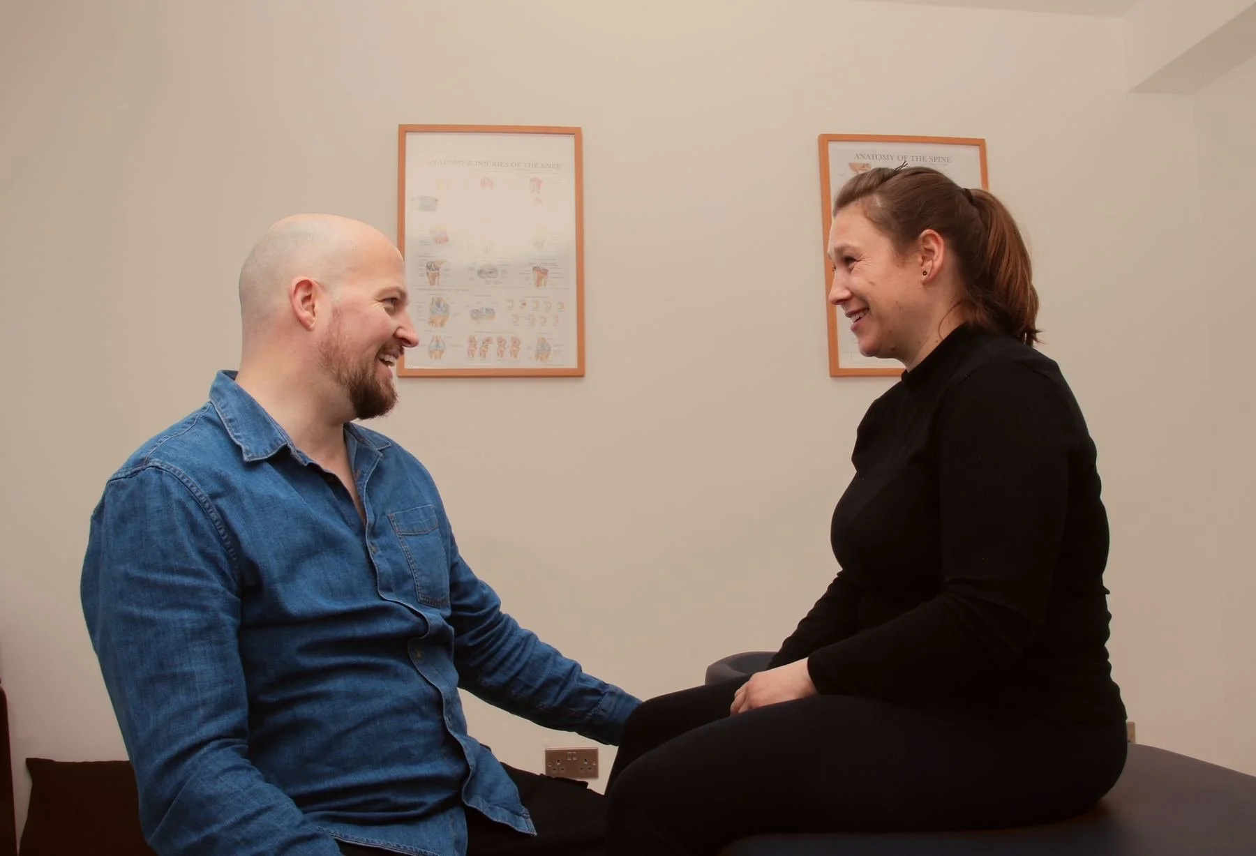 Ben Peters talking with a patient during a Mummy MOT consultation in Hammersmith