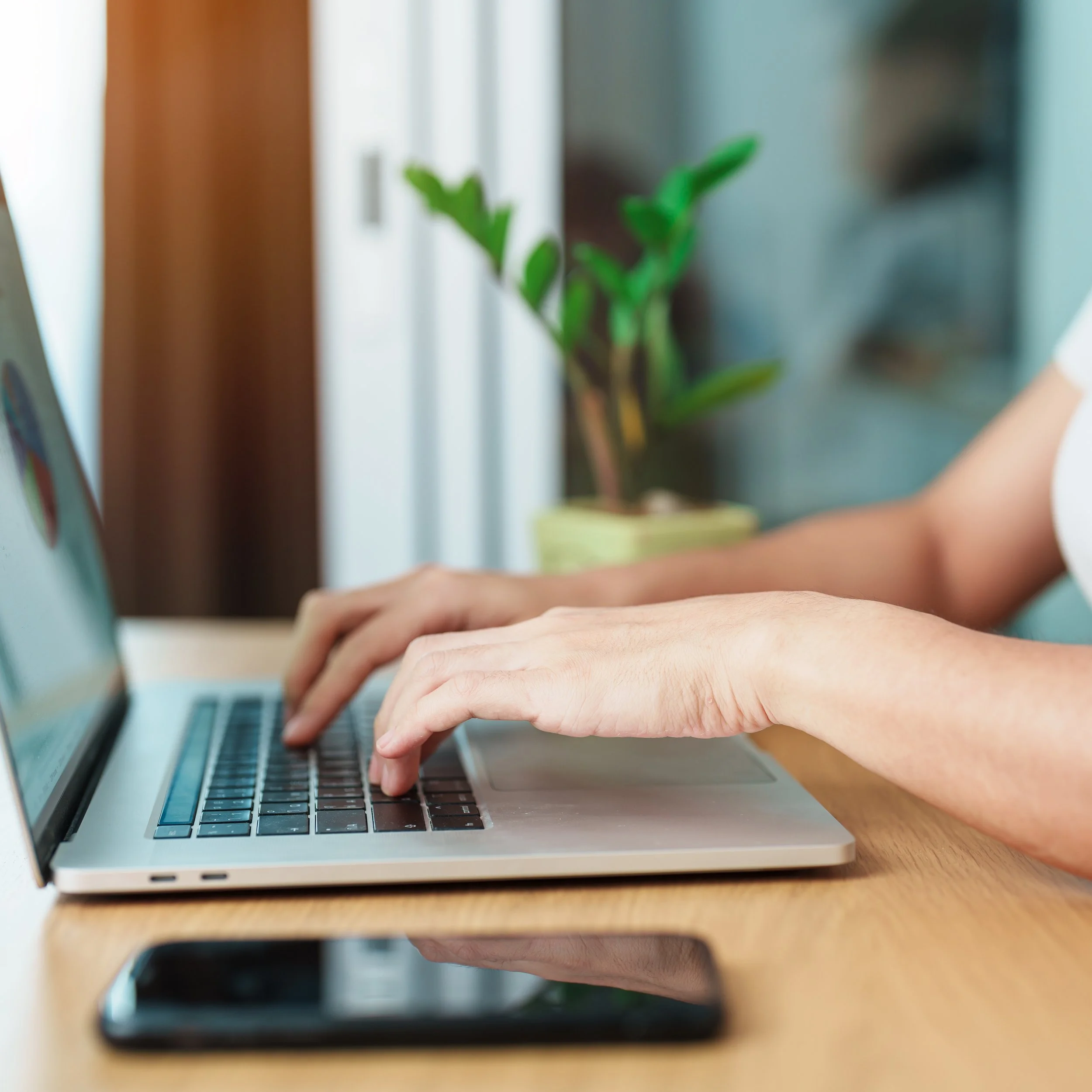 Person researching on laptop