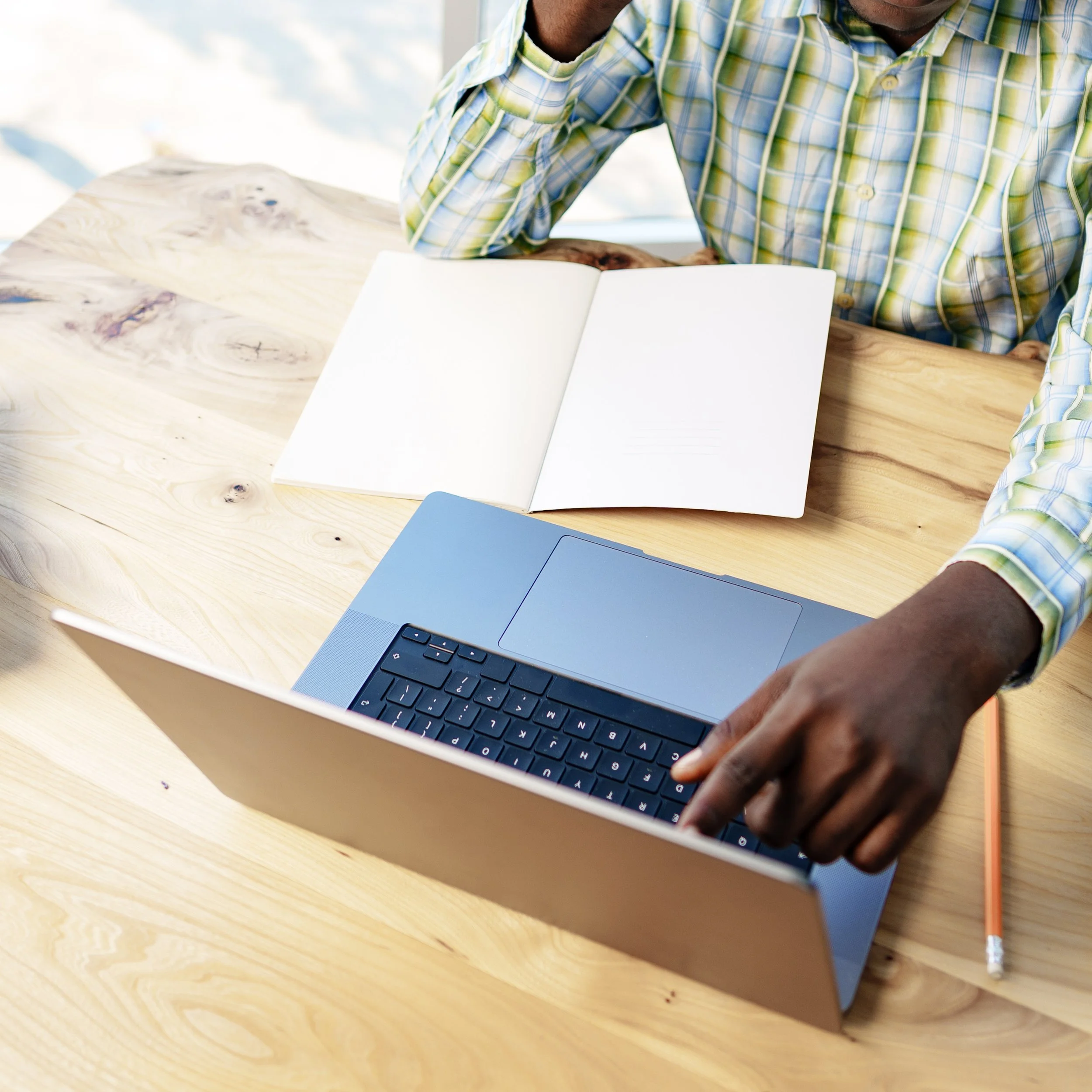 Person researching candidates on laptop