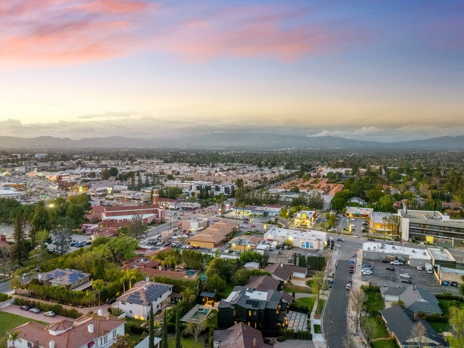 Aerial view of Sherman Oaks at sunset toward the Santa Monica Mountains