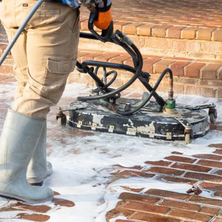white chalky efflorescence deposit on red brick wall