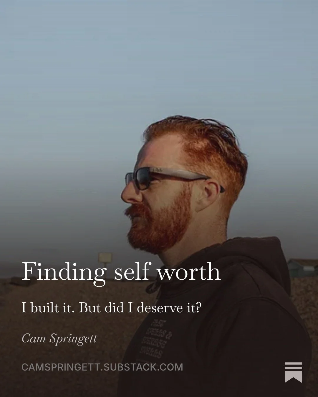 Finding self worth. I built it. But did I deserve it? Cam Springett in profile, wearing sunglasses and a hoodie, looking out at the horizon.