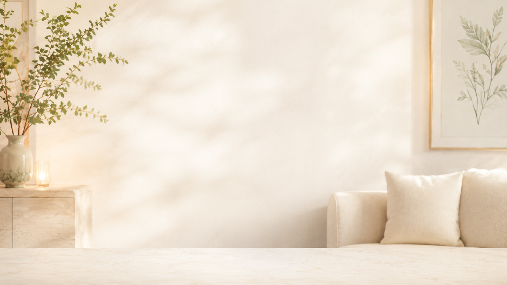 Soft wellness room with greenery, botanical artwork, and cream seating
