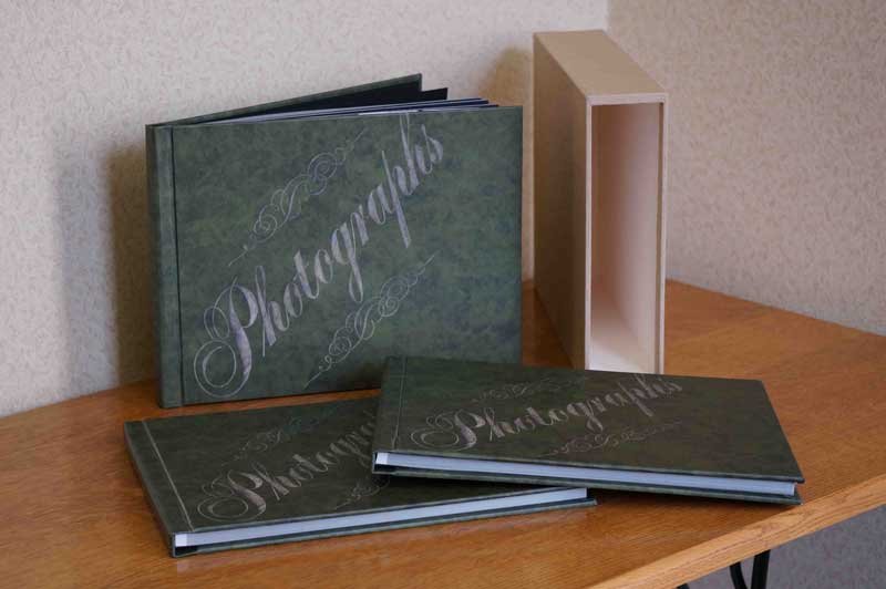 A box of loose family photographs waiting to be organized