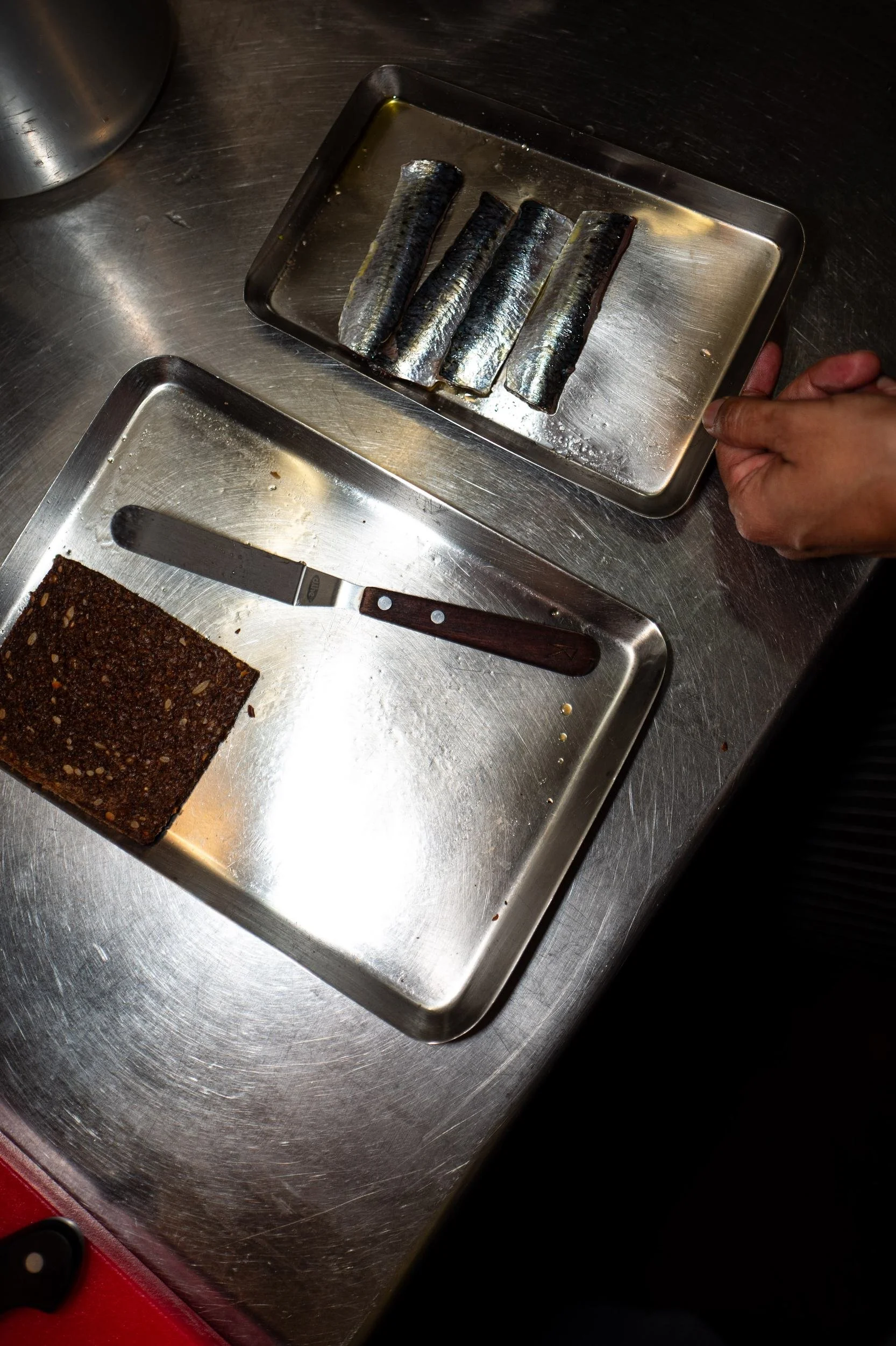 Kitchen sardines dark bread prep trays