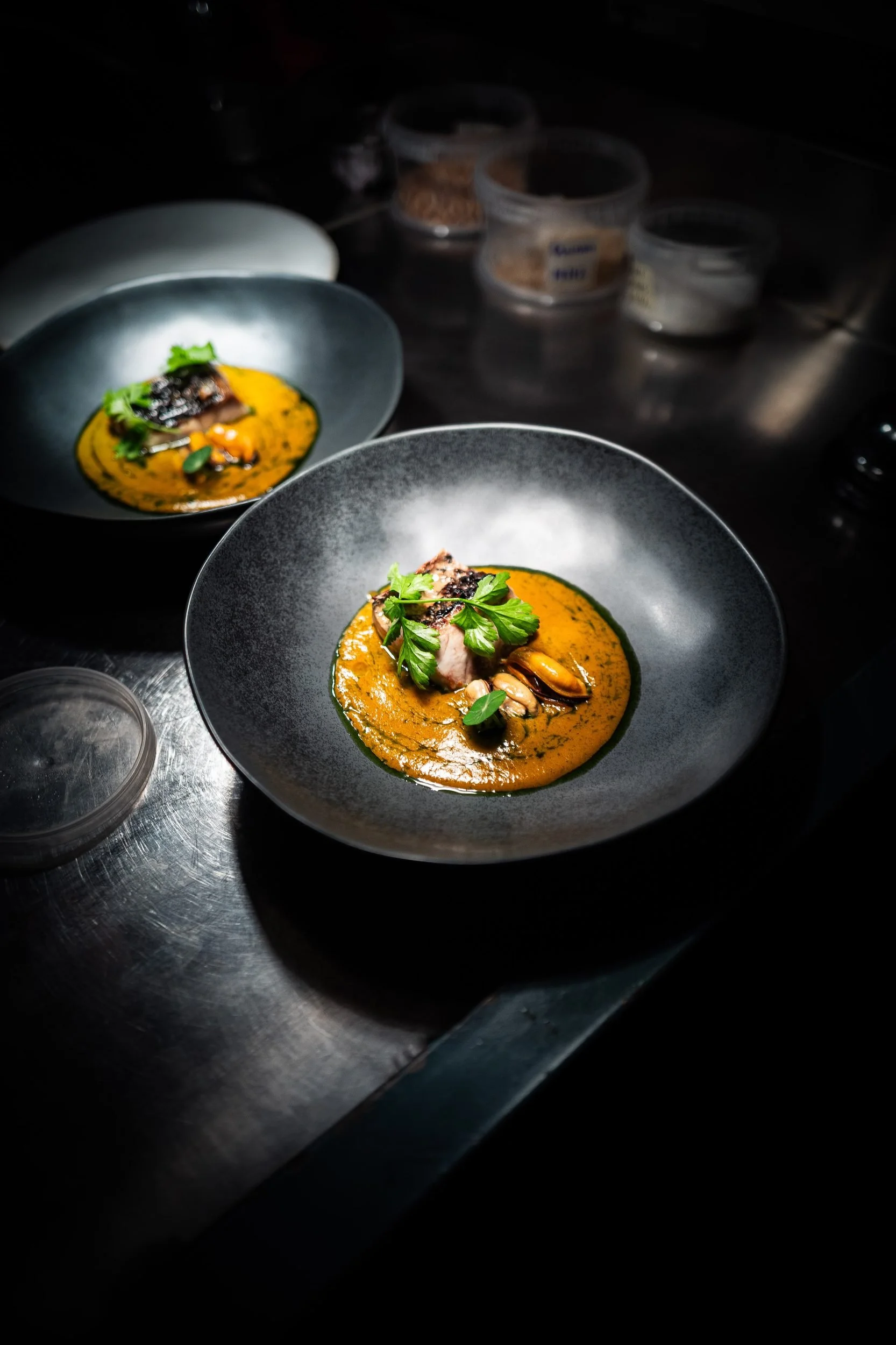 Fish orange sauce dark bowl