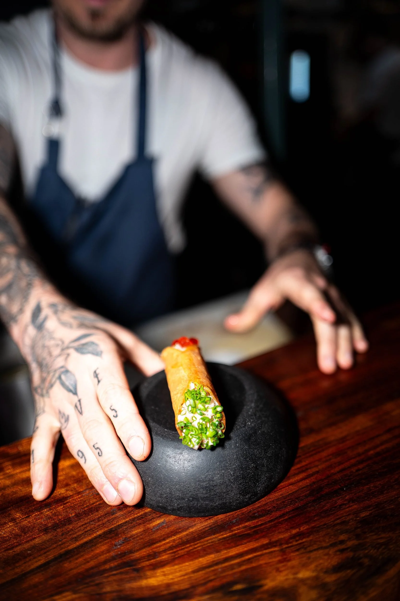 Chef presenting spring roll