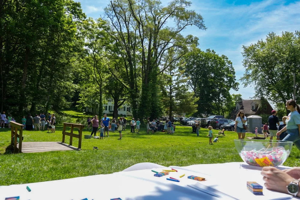 Families gathered at a community event in the park
