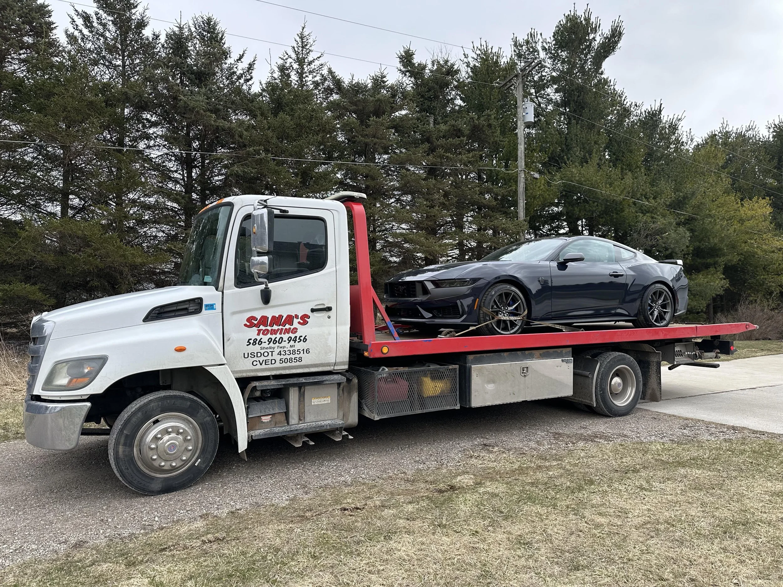 Ford Mustang towed by Sana's Towing