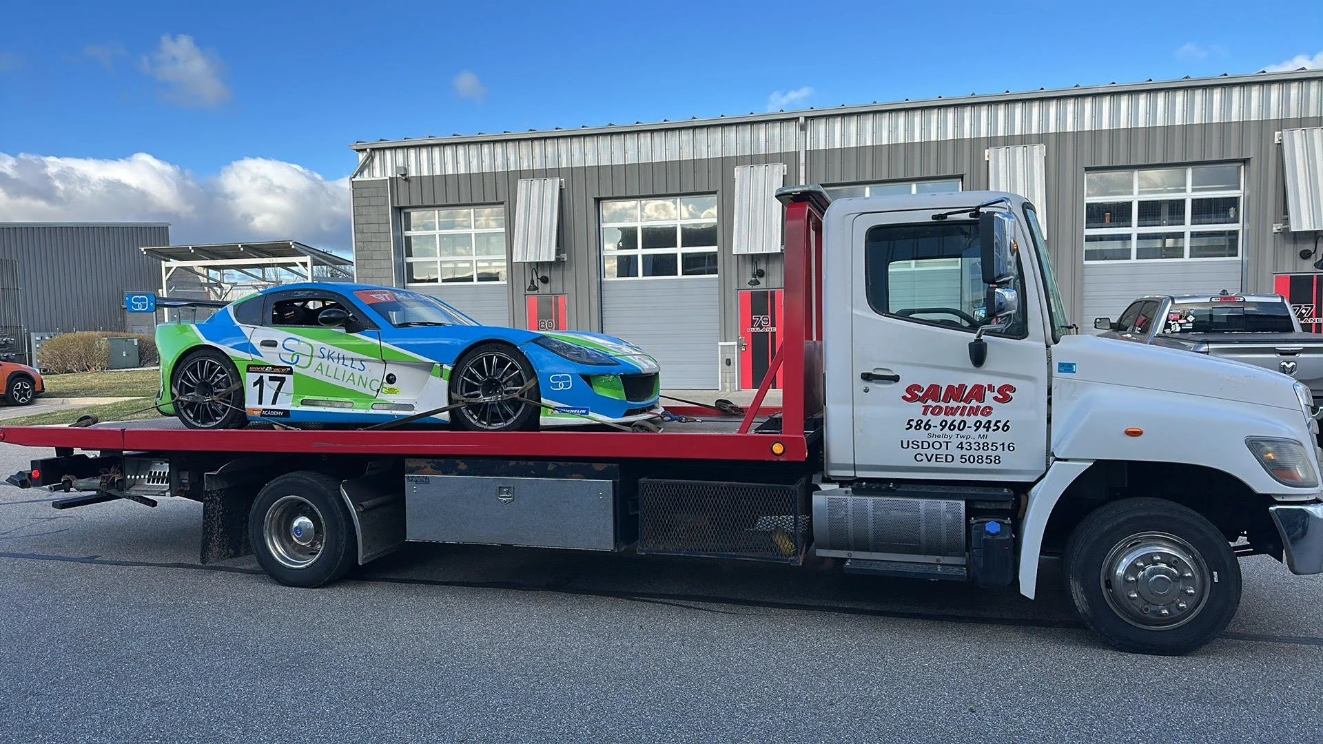 Race car towed by Sana's Towing